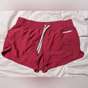 Vuori running shorts (clementine short) reddish pink , size L